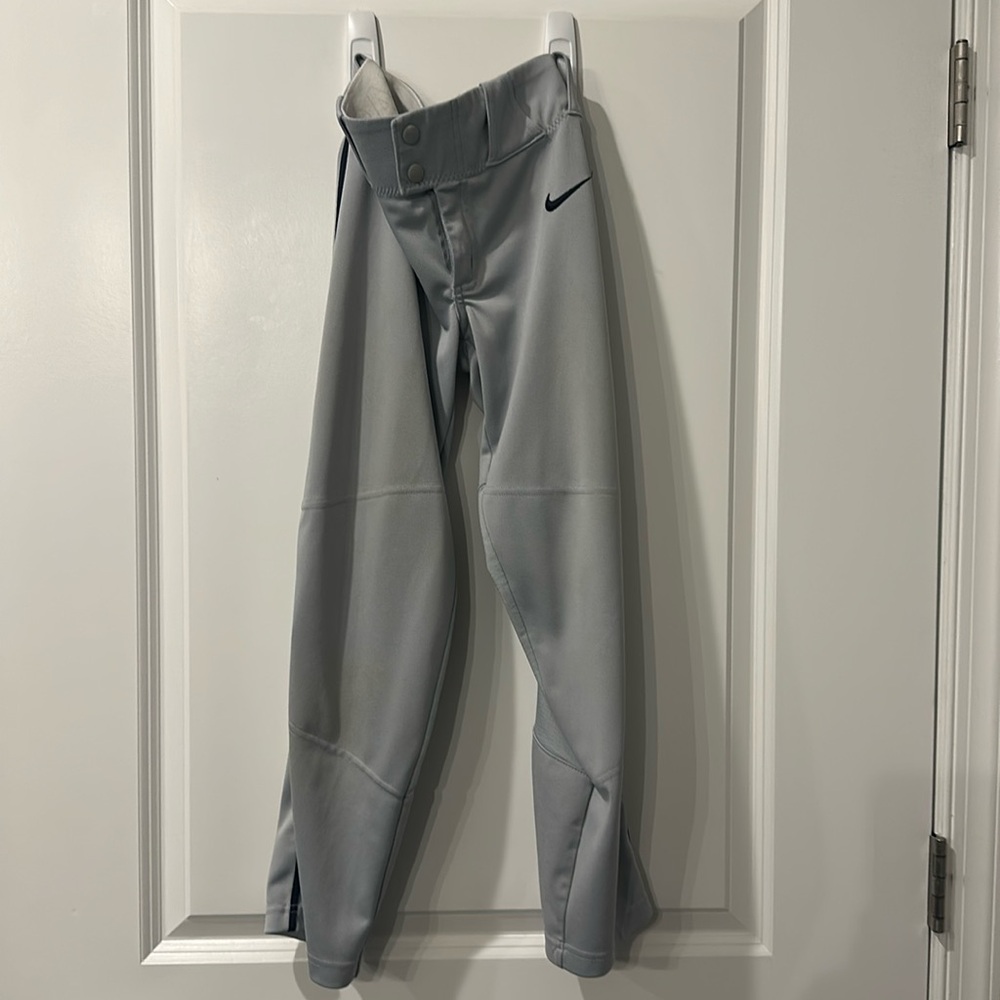 Russell, youth size small, grey baseball pants with navy stripe